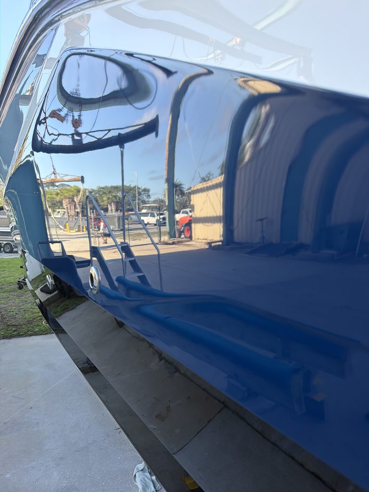 A dark blue hull polished to a sharp reflection