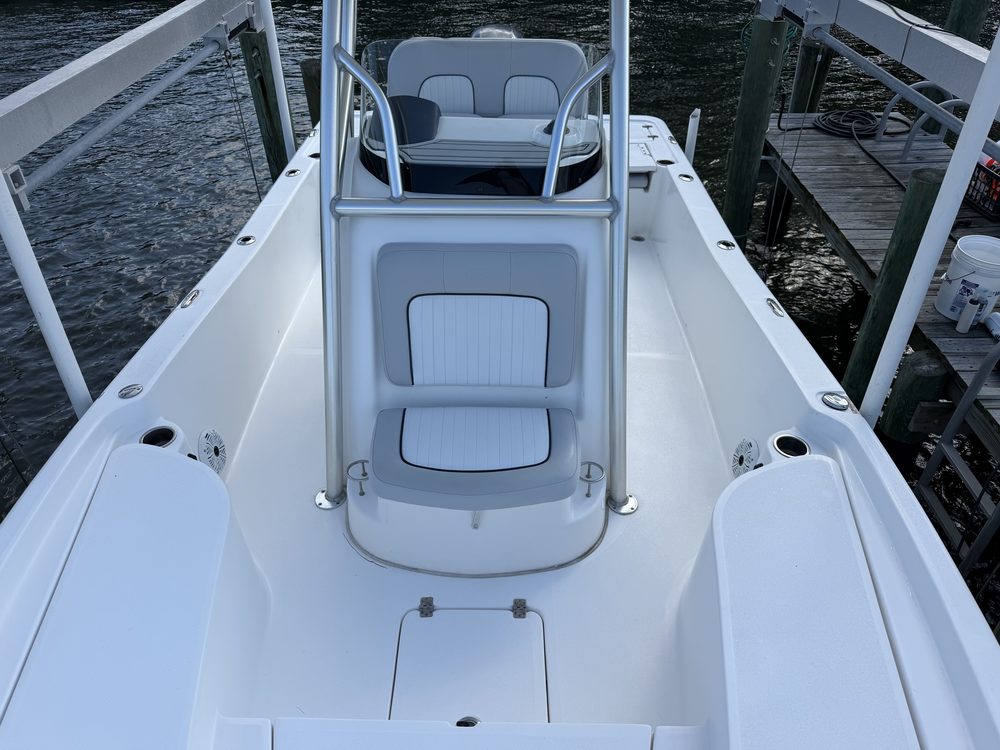 A center console on a lift from the stern, clean deck