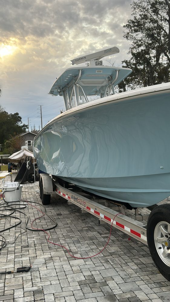 The seafoam center console on its trailer at dusk