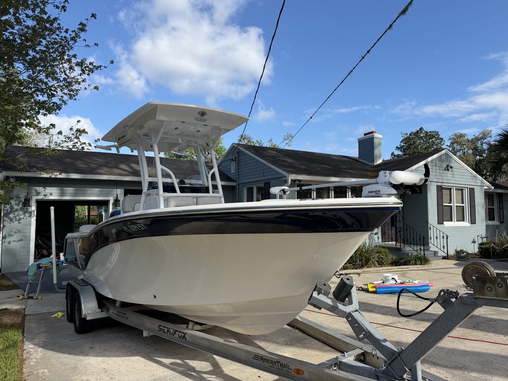 The Sea Fox center console from the bow, on its trailer in a driveway