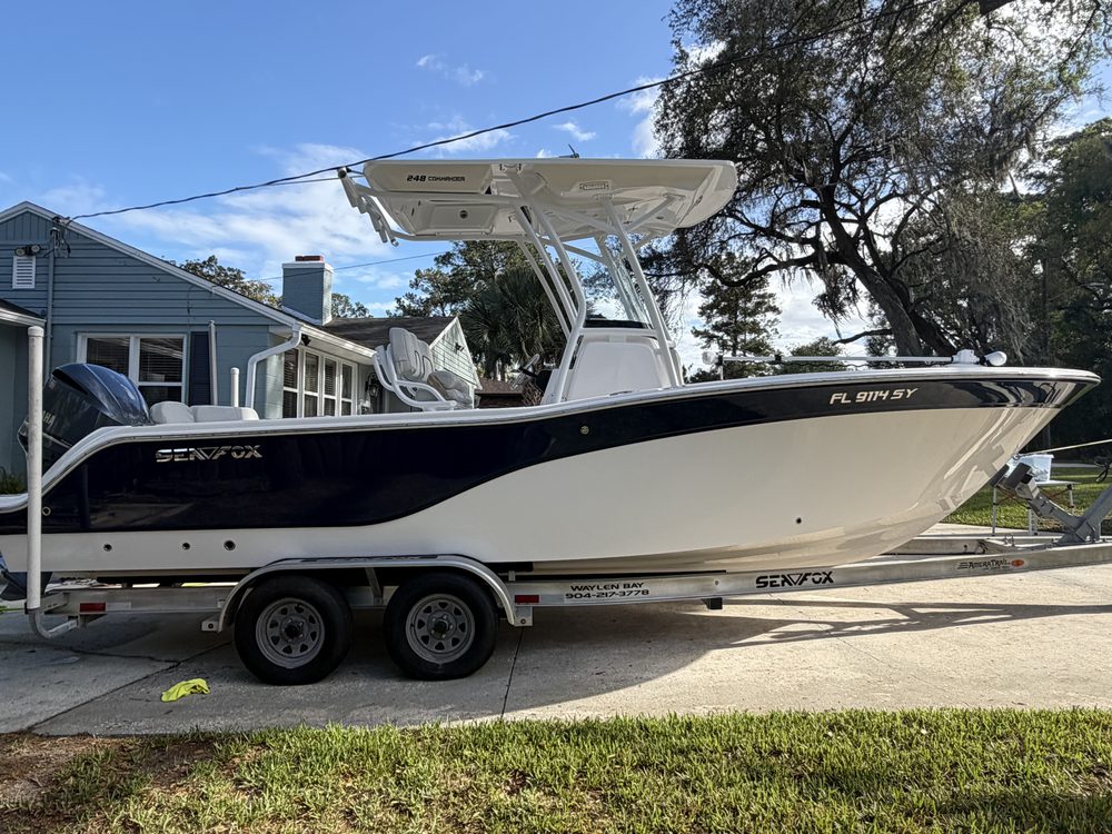 A navy and white Sea Fox center console on its trailer