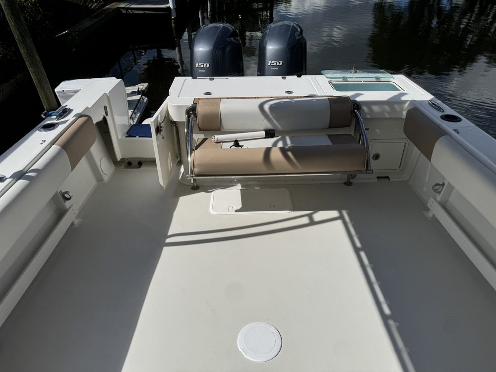 The same cockpit and stern seat after cleaning, twin outboards behind