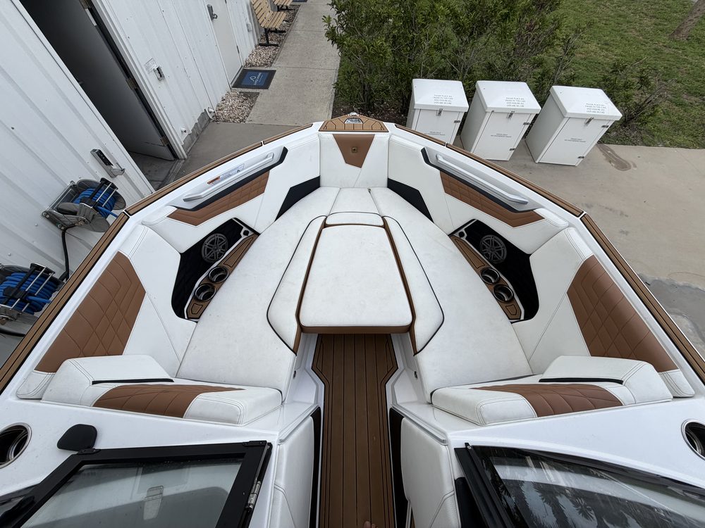 White and brown bow seating on a wake boat, clean
